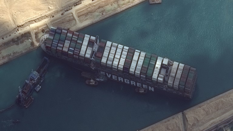 Suez Canal blocked as container ship runs aground